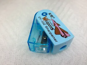 Top view of blue mini sharpener with fighter jet print and internal metal blade detail