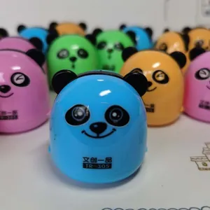 Close-up of colorful panda-shaped pencil sharpeners in blue, pink, and orange tones