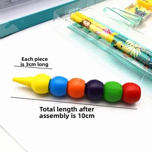 Close-up of detachable 10cm colorful ball crayon with animal print stationery in background