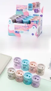 Close-up of dual-hole round pencil sharpeners in Morandi colors with transparent box