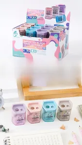 Detailed macro view of Morandi-colored dual-hole pencil sharpeners on a desk