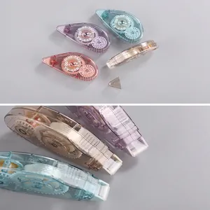 Detail view of colorful glue tape roller showing internal gears and 8m length specification