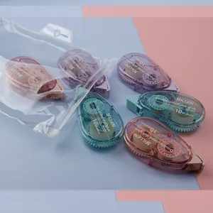 Detail view of colorful double-sided dot glue tapes in a transparent PVC zipper storage bag