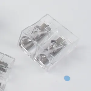 Compact dual-hole transparent pencil sharpener with sharp steel blades and non-slip grip