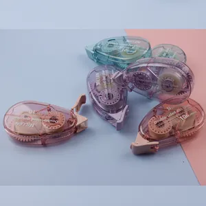Close-up of colorful 10m double-sided adhesive dot glue rollers in macaron colors
