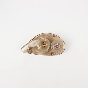 Close-up of DILLEN 8m transparent dot glue tape showing brown casing and internal gears