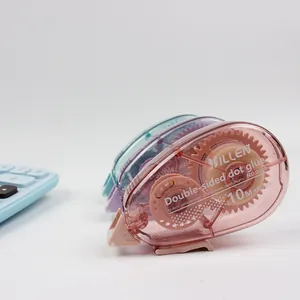 Close-up of pastel dot glue tape rollers in pink, purple and cyan with 10M x 8mm specs