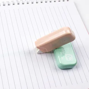 Mini double-sided glue tape pens in pink and mint green colors for students, 6m length