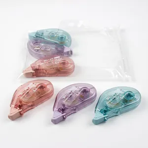 Détail des rollers de colle double face 6m en rose, violet et cyan avec étui