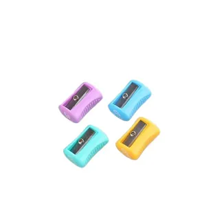 Set of four colorful mini plastic manual pencil sharpeners in purple blue green and orange
