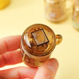 Macro shot of a mini Capybara themed cup pencil sharpener with transparent brown finish