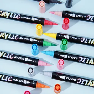 Vibrant multi-color dual-tip acrylic markers set on a light blue background for art
