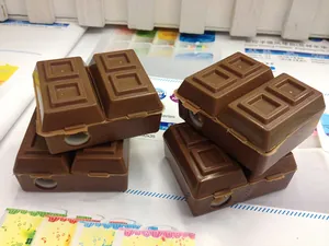 Close-up of creative chocolate-shaped pencil sharpener with dual holes and realistic texture