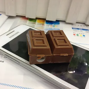 Chocolate-shaped pencil sharpener made of brown plastic displayed on a smartphone