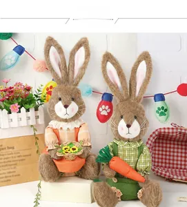Close-up of plush Easter bunnies with carrot and flower basket decorations