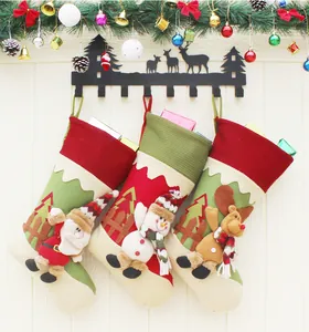 Three festive Christmas stockings with 3D Santa, Snowman, and Reindeer hanging on hooks