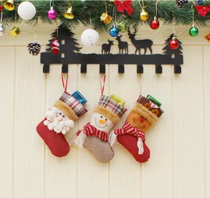Detailed view of festive 3D Christmas stockings with Santa, snowman and reindeer designs