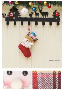 Detail of 3D Santa Claus Christmas stocking with burlap texture and forest metal hooks