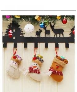 Detailed view of Christmas mini stockings featuring Santa, Snowman and Reindeer ornaments