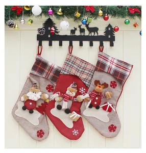Detailed view of large burlap Christmas stockings with 3D Santa, Snowman and Reindeer