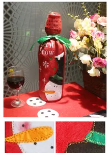 Detail of red snowman Christmas wine bottle cover with sequins and Let it Snow embroidery