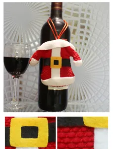Detailed macro view of Santa suit wine bottle covers with red knit fabric and fuzzy white trim