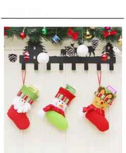 Detailed view of Santa, Snowman and Reindeer Christmas stockings with striped knit cuffs