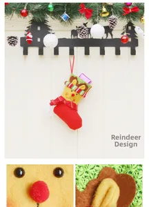 Detail of Christmas reindeer stocking with small gift box hanging on a wooden wall