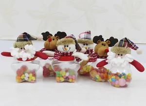 Détails des bocaux à bonbons de Noël avec figurines en peluche et contenants en forme d'étoile