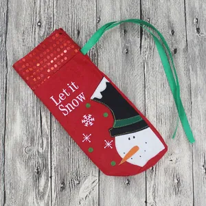 Festive red felt Christmas wine gift bag with Let it Snow snowman embroidery and green handles