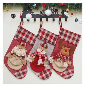 Detail of Christmas stocking set with Santa, snowman and reindeer plush 3D decorations