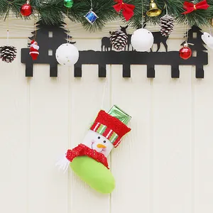 Christmas snowman stockings gift bag with striped knit trim hanging on wall decor
