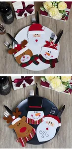 Detailoverzicht van vilt bestekhouders met Kerstman, sneeuwpop en rendier voor de tafel
