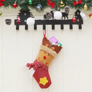 3D Reindeer Christmas stocking gift bag with plush antlers and decorative gift boxes