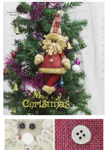 Detail view of plush Santa Claus ornament with plaid hat and Merry Christmas sign