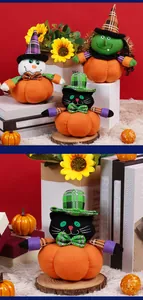 Gros plan de figurines citrouilles d'Halloween avec chat noir et poupées de sorcier