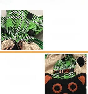 Detail of Halloween fabric gift bag featuring premium embroidery and black cat patterns