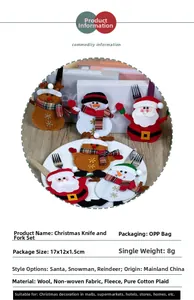 Detailed view of Santa, Snowman and Reindeer cutlery holders on a festive dining table