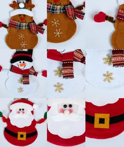 Detail of Christmas felt cutlery holders showing reindeer, snowman and Santa Claus designs