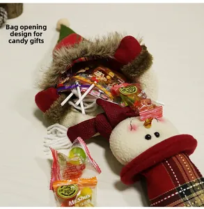 Detail of snowman Christmas gift bag with plaid fabric and faux fur trim for candy
