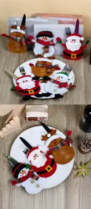 Detail of Santa, Snowman, and Reindeer felt cutlery holders with snowflake embroidery