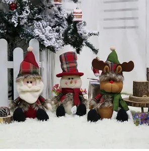 Detailed plush Christmas figurines set with Santa Claus, Snowman and Reindeer on faux fur