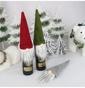 Detailed view of gnome Christmas wine bottle covers with hats and white faux fur beards