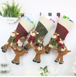 Detailed plush Christmas stockings featuring 3D Santa, reindeer, and snowman figurines