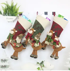 Detailed view of three festive Christmas stockings with reindeer legs and soft plush textures
