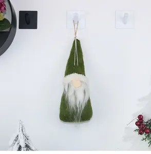 Detail of green Christmas plush gnome hanging ornament with white beard and pointed hat
