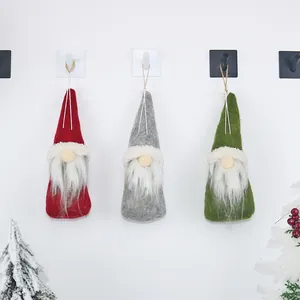 Three Christmas faceless gnome hanging ornaments in red, gray and green felt material