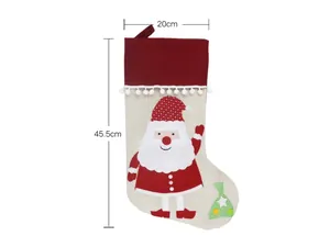 Detailed view of Christmas stocking with Santa patch, measuring 45.5cm in height and 20cm wide