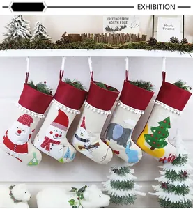 Detailed set of 5 rustic Christmas stockings with festive patterns on white mantel
