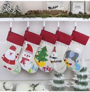 Detailed view of five Christmas stockings with embroidered Santa and reindeer patterns